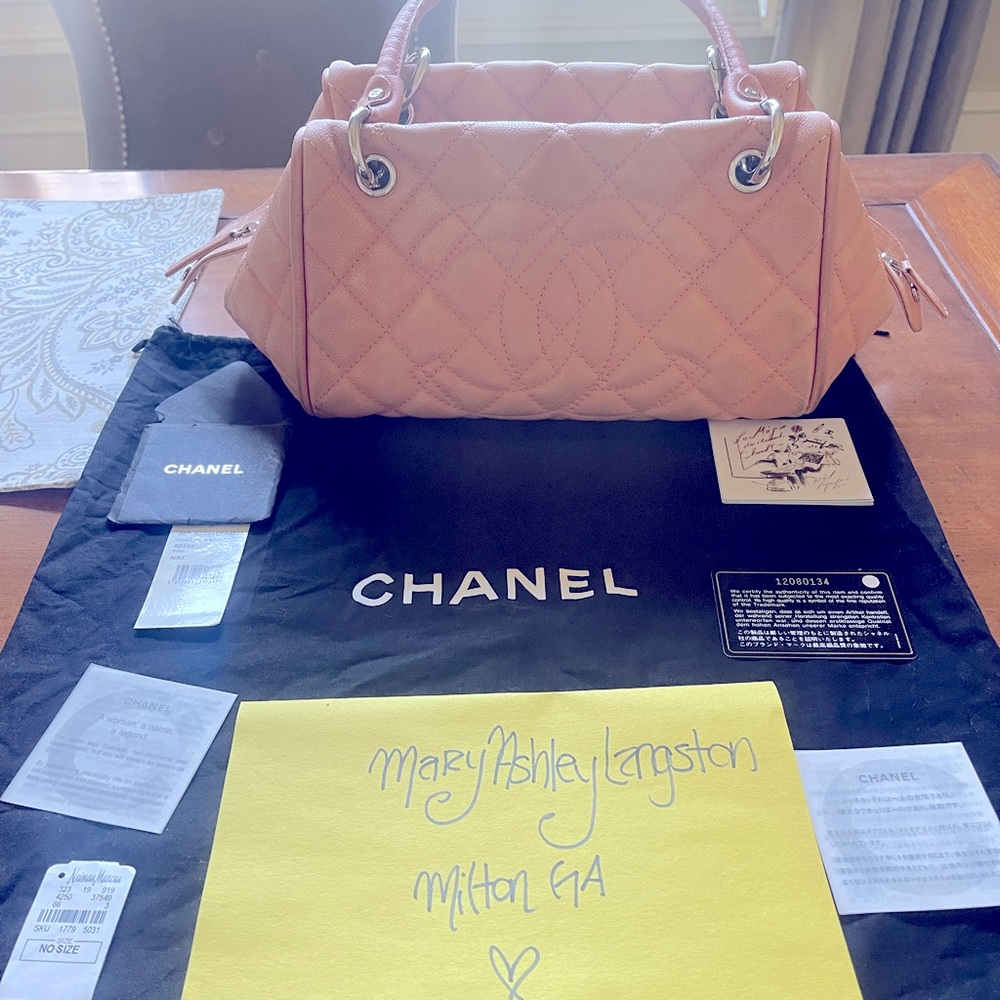 Well loved Chanel light pink caviar leather bag.